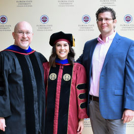 Andrea Tillet with the Dean of the College of Business and her Dissertation Chair