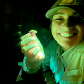 Courtney Whitcher showing her biofluorescent work 