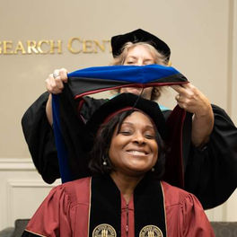 Dr. Christy Chatmon being hooded